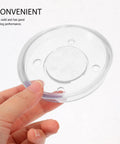 Hand holding a clear part of the Four Piece Pitcher Pump Gasket Set For Hand Water Pumps White PVC Sealing Gaskets