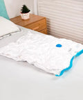 3 Pack Vacuum Compression Storage Bags With Hand Pump For Travel Clothes Clear Large 31.5 Inches By 23.6 Inches on bed