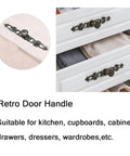 Antique Bronze Vintage Style Cabinet Knobs Set for Furniture with screws shown installed on dresser drawers