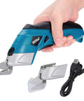 Smooth Cruising Cordless Electric Scissors 37 Volt Rechargeable Fabric Cutter held in hand with spare blades and charging cable.