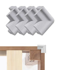 Thickened Foam Corner Bumpers 4 Pack Self Adhesive Bed Frame Guards Table Cabinet Rock Solid Scratch Shield Dead Quiet Cushioning No Fuss Peel And Stick Setup Gray displayed on a table corner.