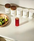 Top Shelf Heat Shrink Wine Caps For Flawless Bottle Sealing Easy Peel Cork Covers on kitchen countertop with limes.