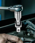 Rock Solid 3 Piece Universal Joint Socket Set With Rotatable Swivel Head For Tough Jobs And Confined Spaces That Make Any DIYer's Toolkit Smaller Yet Super Versatile And Way More Efficient. chrome steel universal joint socket close-up in use on ratchet