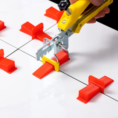 Ultra Thin 0.5mm Tile Leveling System With 2000 Spacers For Floor And Wall Installations Compatible With Most Wedges Thinnest Spacers For Narrow Grout Joints Pro Grade Kit shown in use with tile pliers and spacers on white tiles.