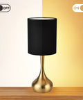 Modern Table Lamp With Brass Droplet Base And Black Linen Drum Shade Perfect For Bedroom Nightstand Living Room Or Office Small Desk Light With Sleek Cylinder Design And Contemporary Metal Finish