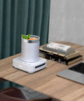Compact Electric Cup Cooler And Warmer With Triple Temp Settings holds a 450ml drink on a desk, perfect for daily sipping.