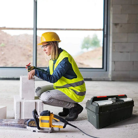 Worker using 18.5 Inch Tool Box Organizer With Adjustable Compartments Portable Tool Storage Chest in construction site.