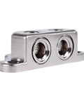 Beefy Ground Termination Block With Highly Conductive Zinc Alloy Three Mounting Points Two Five Millimeter Hex Set Screws And Two Reducers From One Zero To Four Gauge For Auto Audio System Wiring, angled view