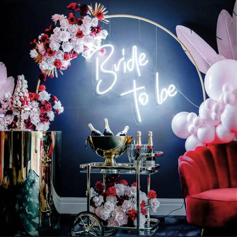Bride To Be Neon Sign For Wall Decor LED Neon Light For Bachelorette Party Engagement Party Birthday Bash Bar Home Decor White Glow Dimmer 50 By 50 Cm Neon Light Party Ready Vibe above festive decor with pink and white balloons flowers and a drink cart