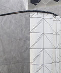 12 Pack Durable Plastic C Shape Shower Curtain Rings With Smooth Glide For Easy Hanging And Quiet Operation In Humid Bathrooms Durable Rustproof Plastic Construction Holds Up In Wet Environments on a black curved shower rod with a patterned curtain.