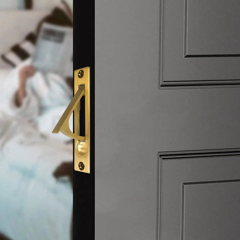 Sleek Hidden Edge Pull For Smooth Sliding Pocket Doors Killer Gold Finish Hardware on dark door, showing modern design and installation.