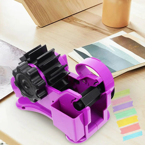 Heavy Duty Semi Automatic Packing Tape Dispenser Smooth Operator Design With Nifty Dual Cutting Station showing purple device on crafting table.