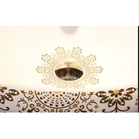 Slick Oval Ceramic Bathroom Sink For Countertop Vanity Rock Solid Above Counter Style With Pop Up Drain No Overflow Easy Setup Knockout Look For Small Half Baths And Daily Home Refreshers featuring decorative golden floral patterns.