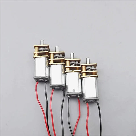 Precision Micro Metal Gear Motor With Compact Gear Wheel Runs Slick On DC 3V To 6V Power Delivers Hard Hitting Torque At 25 To 50 RPM shown in a row, featuring metal casing and wires.