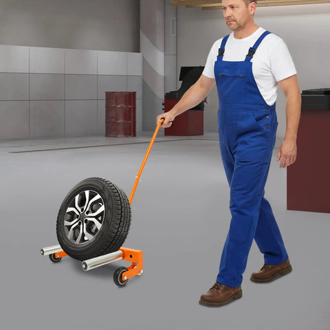 Person using Beefy Heavy Duty Tire Dolly For Garage And Auto Repair Wheel Tire Moving Cart for transferring heavy wheels safely.