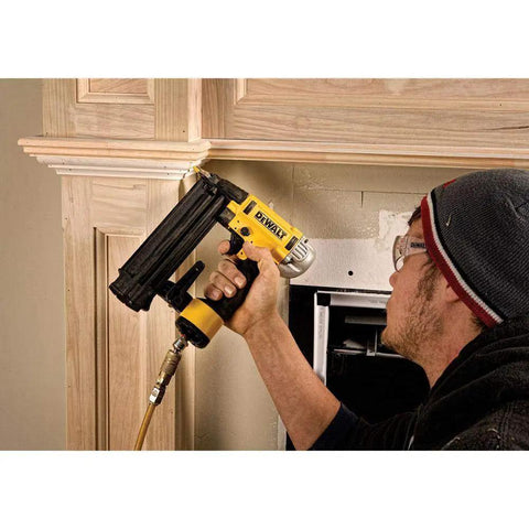 Professional 18 Gauge Brad Nailer With Rear Exhaust Blasts Dust Away Tight Trigger in use for cabinet work.