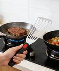 Stainless steel fish spatula with slotted blade and black silicone handle, 10.3-inch