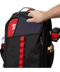 Badass Low Profile Backpack With Twenty Two Pockets And Heavy Load Bearing Harness For Tradesmen Ballistic Canvas Build tablet being inserted into front pocket