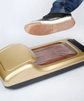 Top Tier Disposable Shoe Film Refill Rolls For Automatic Shoe Cover Machines in use with foot entering dispenser.