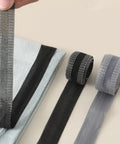 Iron On Hem Tape 5m Roll For Jeans And Heavy Fabric No Sweat Fix Quick Pants Mending Adhesive Strip Tailor Free Clothing Repair Tape showing three rolls in black and grey.