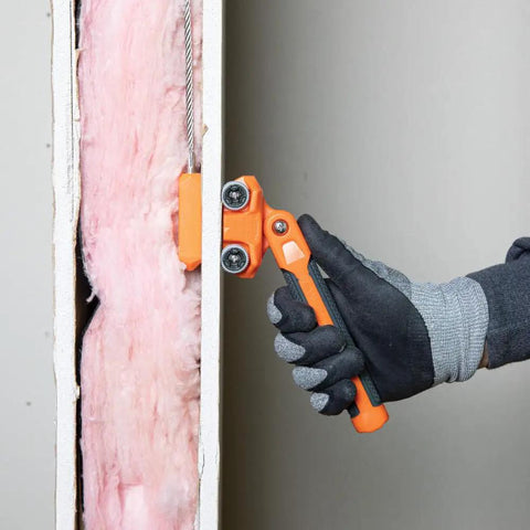 Hand using Pro Grade Magnetic Wire Puller For Behind Walls And Tight Spaces With Rare-Earth Magnets, Stainless Steel Leader.