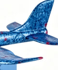 Close-up of a blue foam glider tail, 7.68in, designed for outdoor play. Foam Gliders For Backyard Fun And Outdoor Play Lightweight 7.68 Inch Foam Launchers For Kids Totally Easy Toss Soaring Summer Recreation Beach And Park Entertainment Safe Compact Planes That Boost Hand Eye Coordination.