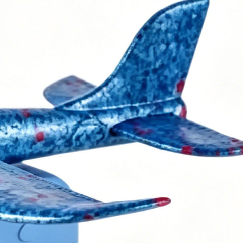 Close-up of a blue foam glider tail, 7.68in, designed for outdoor play. Foam Gliders For Backyard Fun And Outdoor Play Lightweight 7.68 Inch Foam Launchers For Kids Totally Easy Toss Soaring Summer Recreation Beach And Park Entertainment Safe Compact Planes That Boost Hand Eye Coordination.