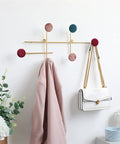 Slick Wall Mounted Coat Rack With Heavy Duty Adhesive Hooks And Key Holder For Mudroom Setup features pink coat and white handbag.