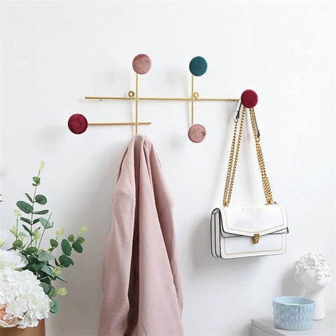 Slick Wall Mounted Coat Rack With Heavy Duty Adhesive Hooks And Key Holder For Mudroom Setup features pink coat and white handbag.
