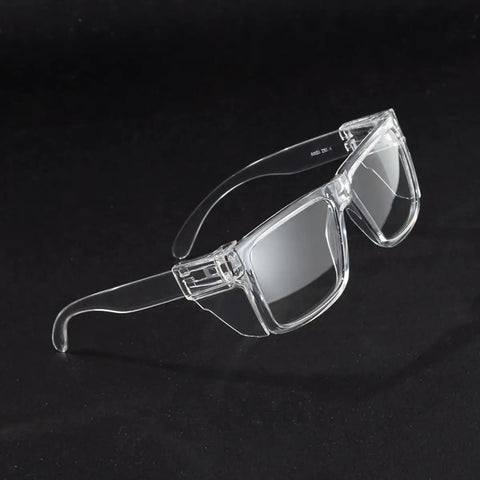Photochromic Safety Glasses Featuring Blue Light Blocking Armor And Scratch Resistant Glass, clear frame, angled view.