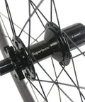 Hub detail of Rad Carbon Road Wheelset 700c Clincher Ride Ready 38mm Deep 23mm Wide Center Lock Thru Axle