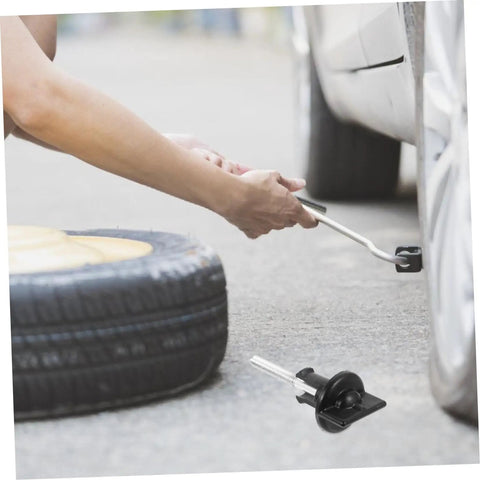 Spare Tire Hold Down Bolt Kit For Car Wheel No Hassle Install Retainer Clamp Replacement Tire Bolt Holder For Truck SUV Sedan Great For DIY Repairs And Wheel Security shown during use with tire change.