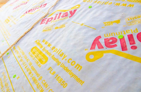 Top Shelf Synthetic Roofing Underlayment 4 X 250 Feet Roll Heavy Duty Polymer Sheets on a roof showing surface details.
