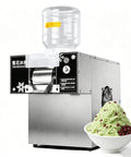 Commercial Snow Cone Machine Heavy Duty Stainless Steel Ice Shaver No Sweat Snowflake Maker with bowl of shaved ice.