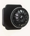 Matte Black Cabinet Knobs 4 Pack With 1.6 Inch Square Backplates Vintage Floral Petal Design close-up view on white background