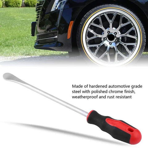 Beefy Heavy Duty Steel Tire Spoon Tool For Cars And Motorcycles, Chrome Vanadium Build With Non Slip Handle in front of car.