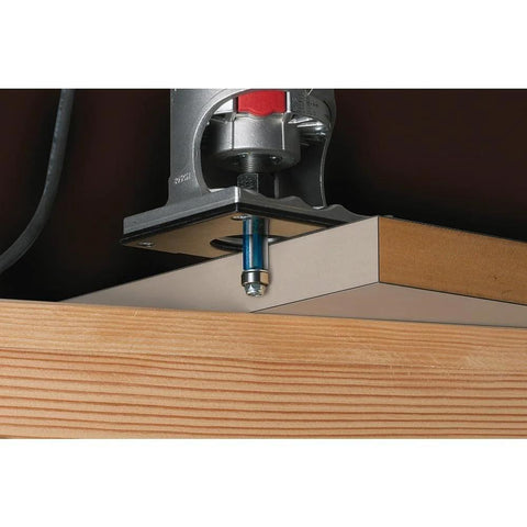 Bosch 1/4 in. x 3/4 in. high-speed steel 1-flute pilot panel straight router bit installed in router