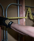 Person using Six Foot Folding Ruler With Inside Reading, Built Tough Fiberglass Construction, Nylon Reinforced, against pipes