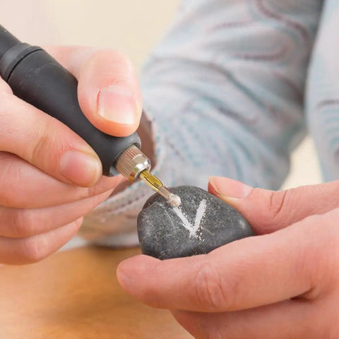 Person using Drill Chuck Collet Set For Dremel Tools, engraving on stone with 3 jaw chuck, precise DIY application