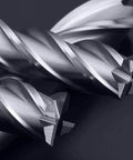 Two HSS 4‑flute end mills from a 6‑piece set; straight cutters, metallic silver