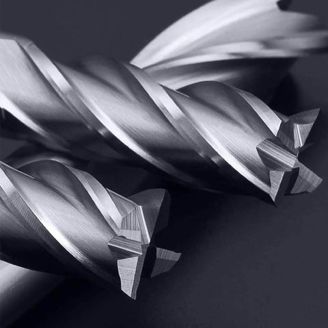 Two HSS 4‑flute end mills from a 6‑piece set; straight cutters, metallic silver