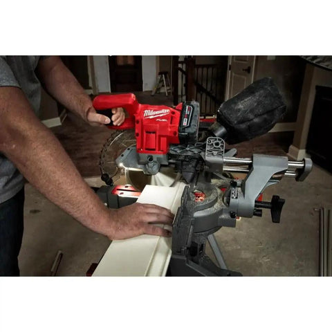 User operating Ultra Portable Aluminum Folding Miter Saw Stand with universal mounting brackets, supports 500 lbs, extends 100 inches.