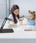 Woman and child using 5X And 10X Magnifying Lamp With Stand Clamp Lighted Magnifier For Close Work Crafting Sewing Model Making Jewelry Soldering.