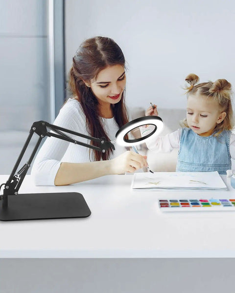 Woman and child using 5X And 10X Magnifying Lamp With Stand Clamp Lighted Magnifier For Close Work Crafting Sewing Model Making Jewelry Soldering.