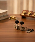 Premium White Ukulele Tuner Pegs And Keys With Smooth Gear Action Compact Metal Alloy Machine Heads featuring decorative plates.