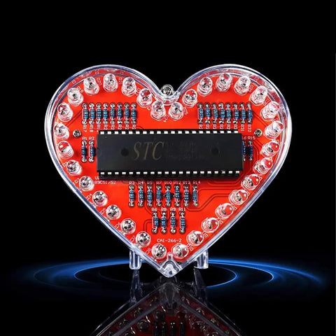 Heart Shaped LED Flashing Light Kit With 51 Microcontroller for Electronics, featuring 32 colorful 5mm LEDs on a red circuit board