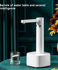 Desktop Water Dispenser With Hot And Cold Water, Three Level Volume Control, USB Charging, Electric ABS Pump, on table with glass