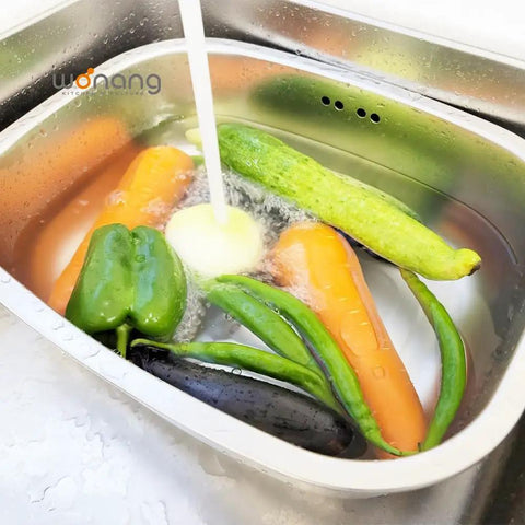 Big 9.9L Stainless Steel Dishpan For Everyday Kitchen Cleanup with vegetables being washed under running water, rustproof basin