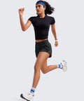 Woman running in high waisted running shorts two and a half inch inseam black small for women ultra soft quick dry fabric featherlight comfort.