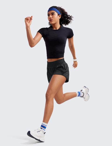 Woman running in high waisted running shorts two and a half inch inseam black small for women ultra soft quick dry fabric featherlight comfort.